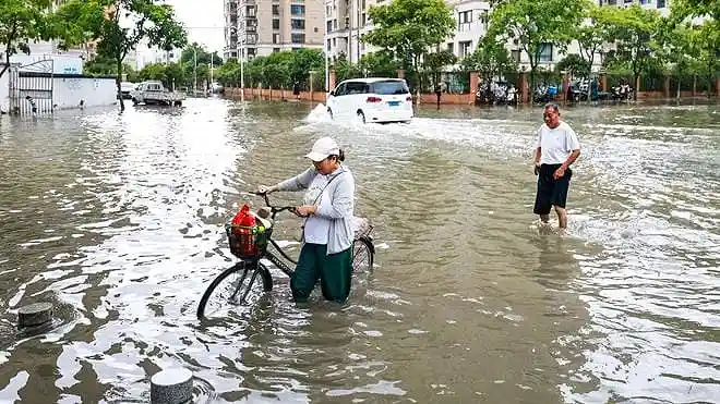 Flooded streets and submerged vehicles in northern China's Hebei Province after heavy rainfall.