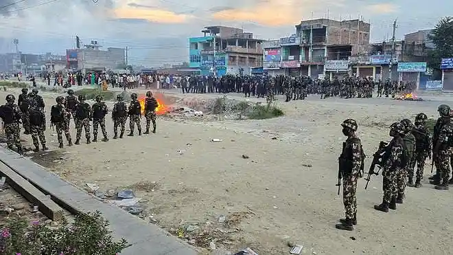 Members of the Nepal Army and Nepal Police stand guard as protesters gather following communal clashes in Siraha, Nepal, on July 30, 2026.