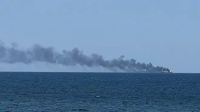 Smoke rises from a civilian vessel on fire following a Russian attack in Odesa, Ukraine, on July 19, 2026.