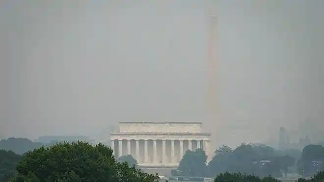 Wildfire smoke from Canada blankets the U.S. as President Donald Trump threatens higher tariffs over cross-border pollution