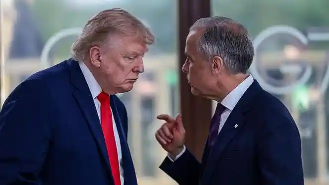 U.S. President Donald Trump speaks with Canadian Prime Minister Mark Carney. File photo.