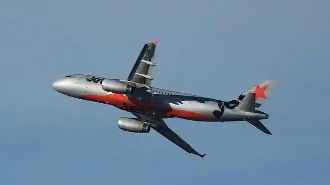 A Jetstar passenger jet takes off from Sydney Airport in Sydney.