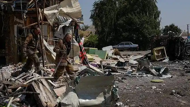 Rescuers work at the site of Russian drone strikes in Pechenihy, Kharkiv region, Ukraine.