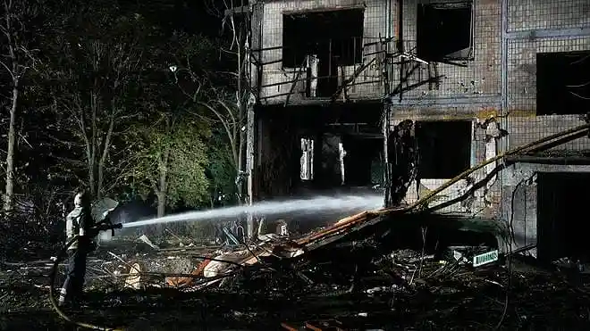 Emergency responders extinguish a fire after Russian missile strikes in Kyiv, Ukraine, on August 1, 2026.