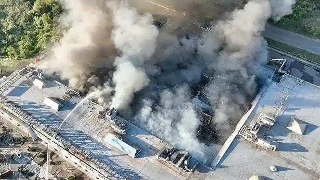 Firefighters battle a fire at a shopping mall after a Russian drone attack in Kryvyi Rih, Ukraine, on August 21, 2026.